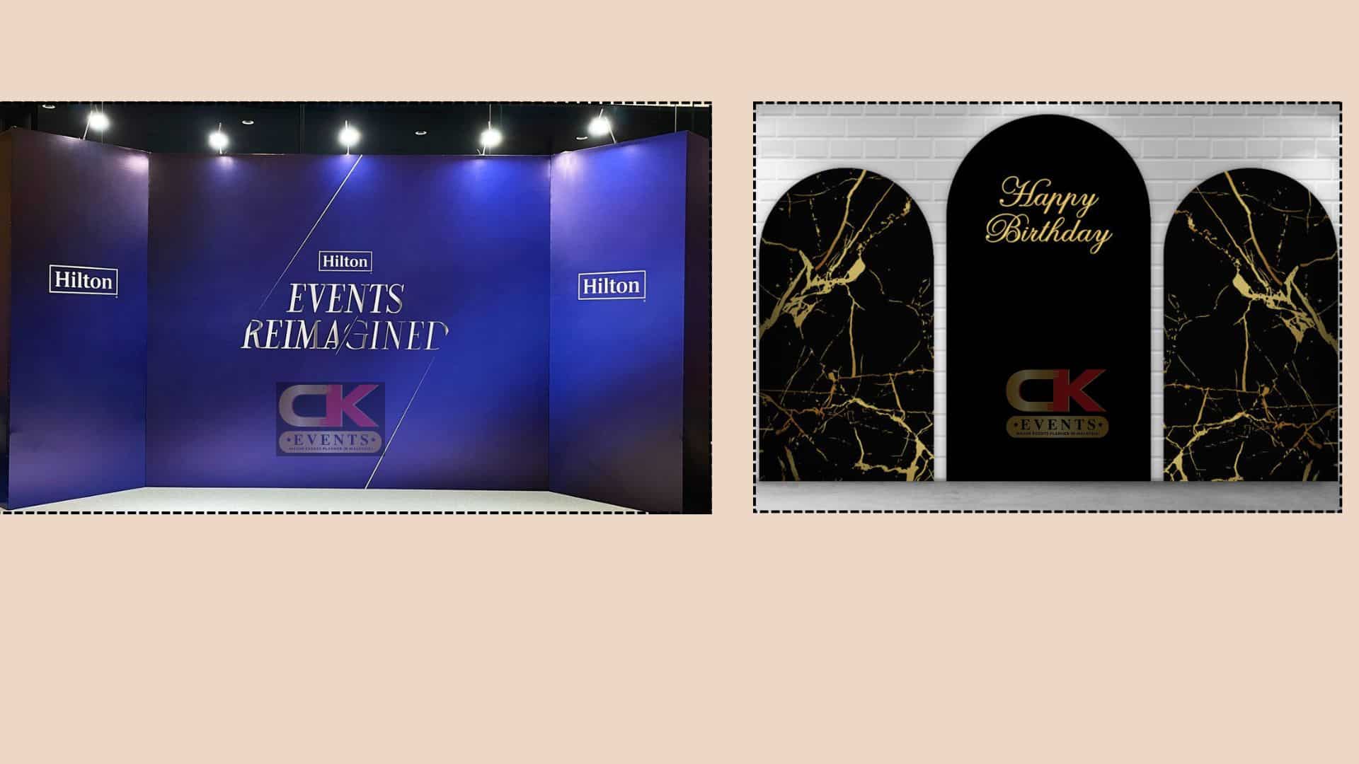 Blue corporate panel wall and black marble-effect birthday arches