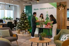 Maxis christmas corporate event design reference with office christmas staff gift and photo station