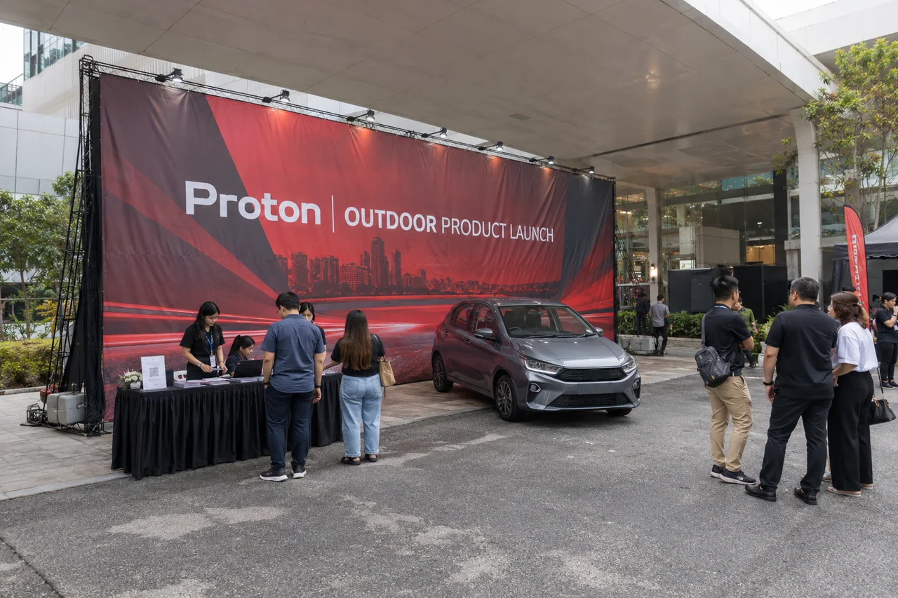 Proton outdoor product launch design reference with covered outdoor passenger-car launch wall