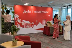 AirAsia office raya event design reference with office raya staff photo station